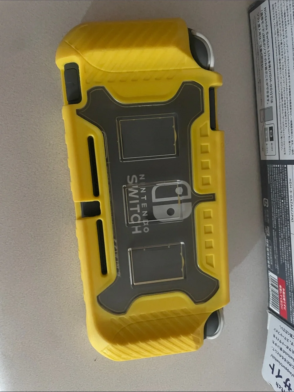 Nintendo Switch Lite Gray with Yellow Case with game